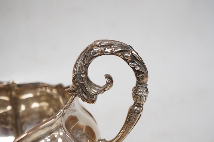 A George IV silver cream jug, with engraved monogram, by William, Charles and Henry Eley, London, 1824, height 10.5cm, 7.7oz.